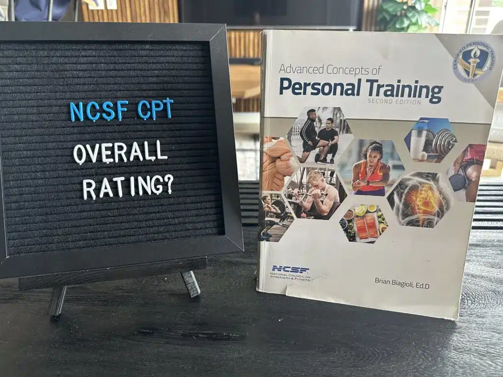 ncsf cpt certification overall rating - NCSF certification textbook displayed on table with lettering board