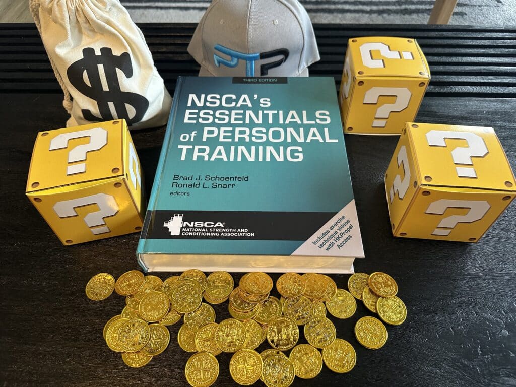 nsca cpt certification cost and study options. NSCA personal trainer textbook on table with gold coins