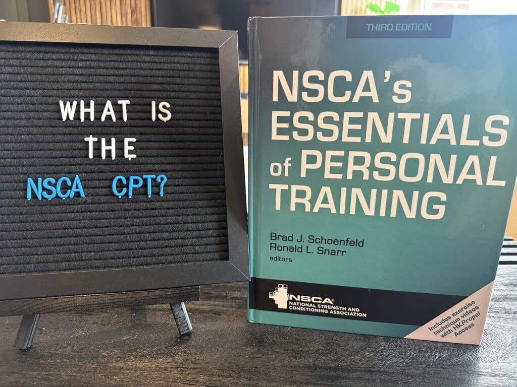 what is the nsca cpt - NSCA essentials of personal training textbook displayed on table