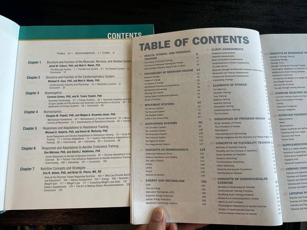 NSCA and ISSA textbooks open to table of contents page with chapters 