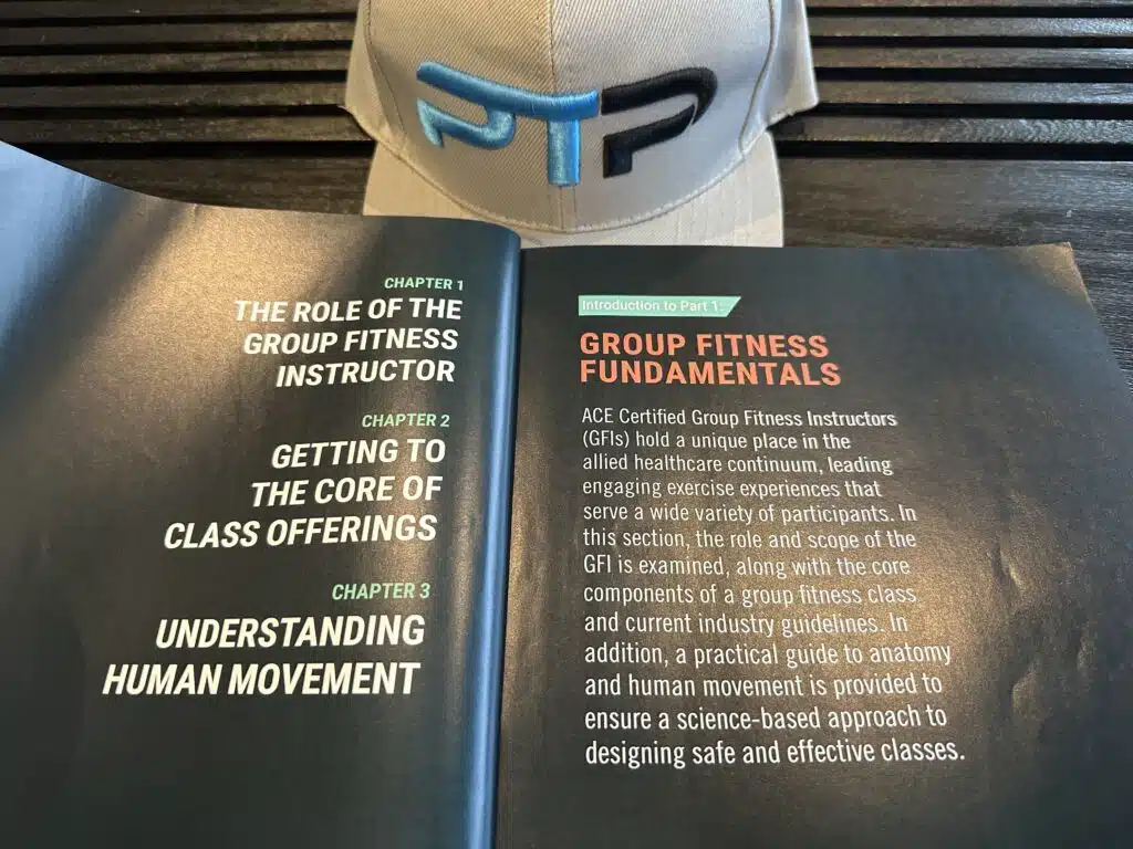 The Ultimate ACE Group Fitness Instructor Review 10 ace group fitness instructor - ace textbook open to table of contents next to ptpioneer hat - course layout