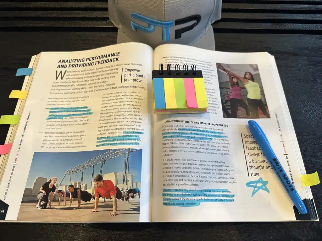 The Ultimate ACE Group Fitness Instructor Review 11 ACE group certification - textbook open with notes tabs - ace gfi exam prep