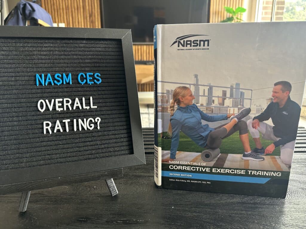 nasm ces program overall rating - nasm ces certification textbook displayed on table with lettering board