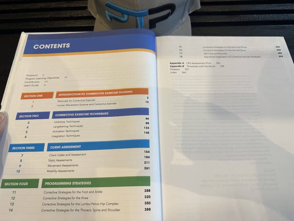 NASM course layout - NASM CES textbook open to table of contents to display NASM CES certification curriculum