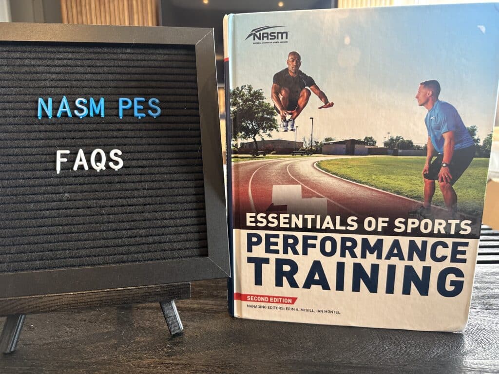 nasm pes FAQs - nasm pes textbook on table with frequently asked questions regarding nasm performance enhancement specialist 