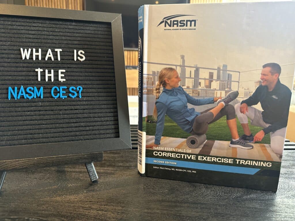 What is the NASM corrective exercise specialist? NASM study materials displayed on table next to whiteboard asking "What is the NASM CES?"