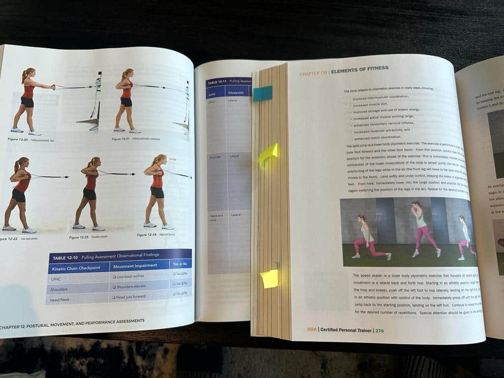 ISSA vs NASM - textbooks open to page on exercise technique 