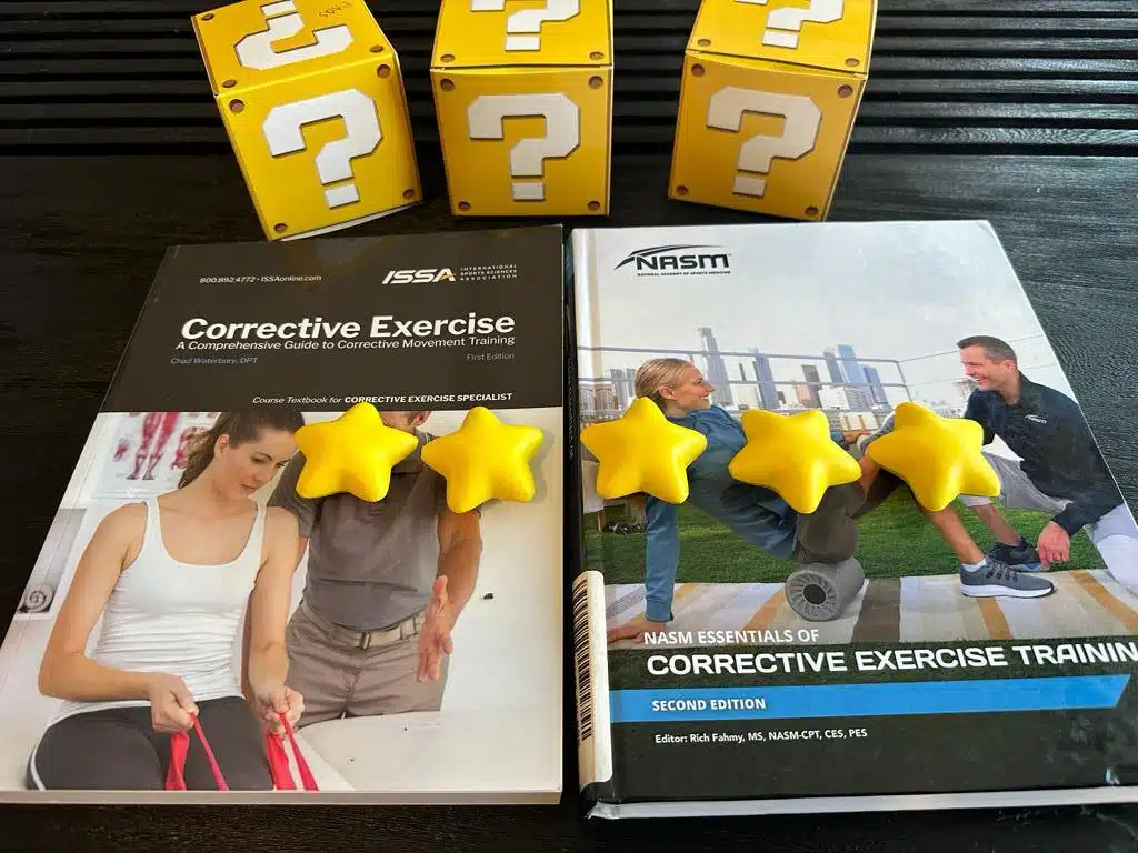 Best Corrective Exercise Training Program (ISSA vs NASM vs TBMM) 22 best corrective exercise program - overall rating nasm and issa- textbooks laid on table with stars