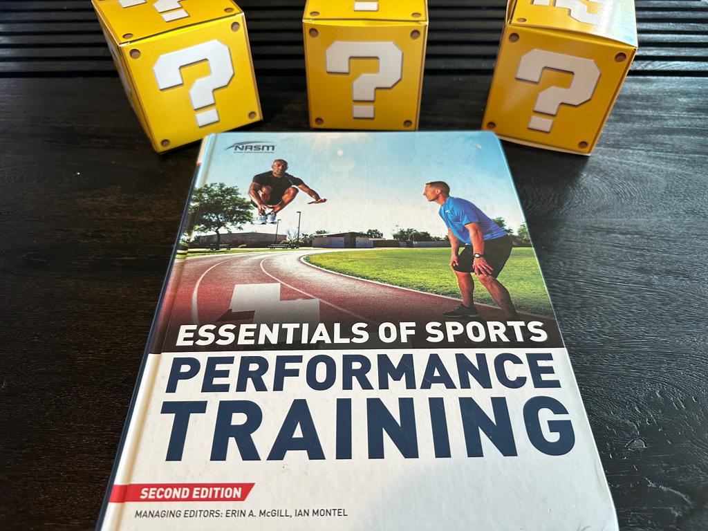 5 best strength and conditioning certifications - the NASM essentials of sports performance training textbook with yellow question mark boxes