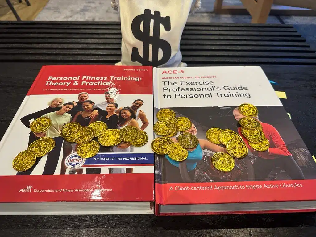 ace vs afaa cpt - textbooks for ace and afaa on table with gold coins and money bag, which costs more?