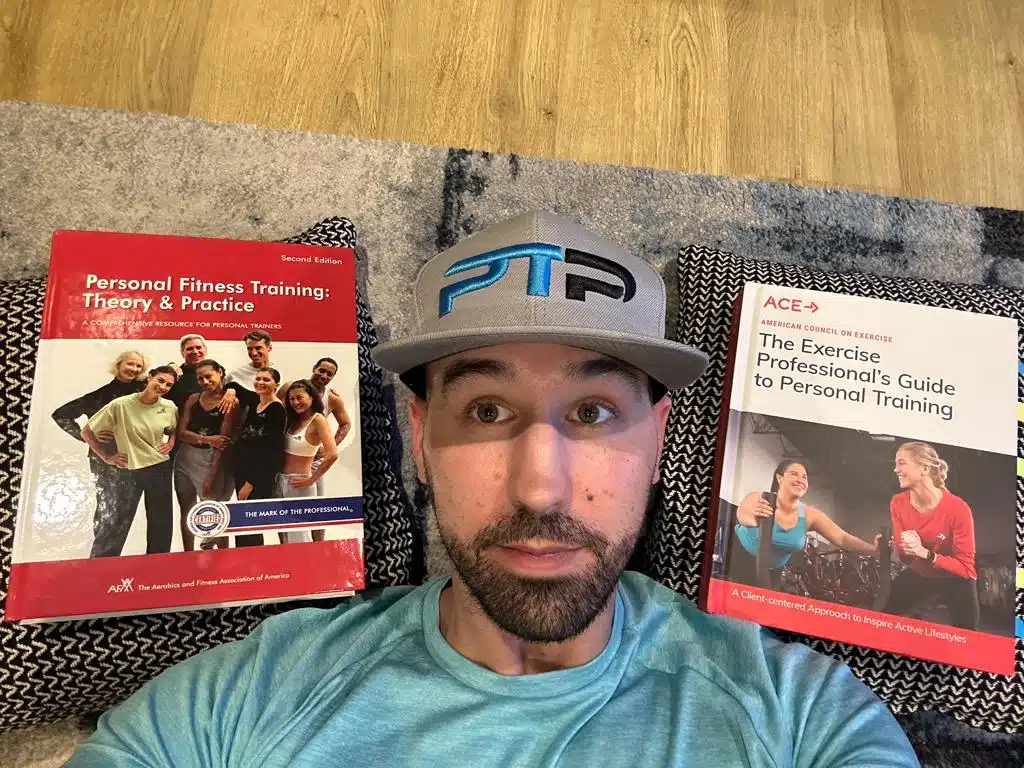 ACE vs AFAA - Tyler lays on carpet next to afaa and ace textbooks - which is best, ace or afaa