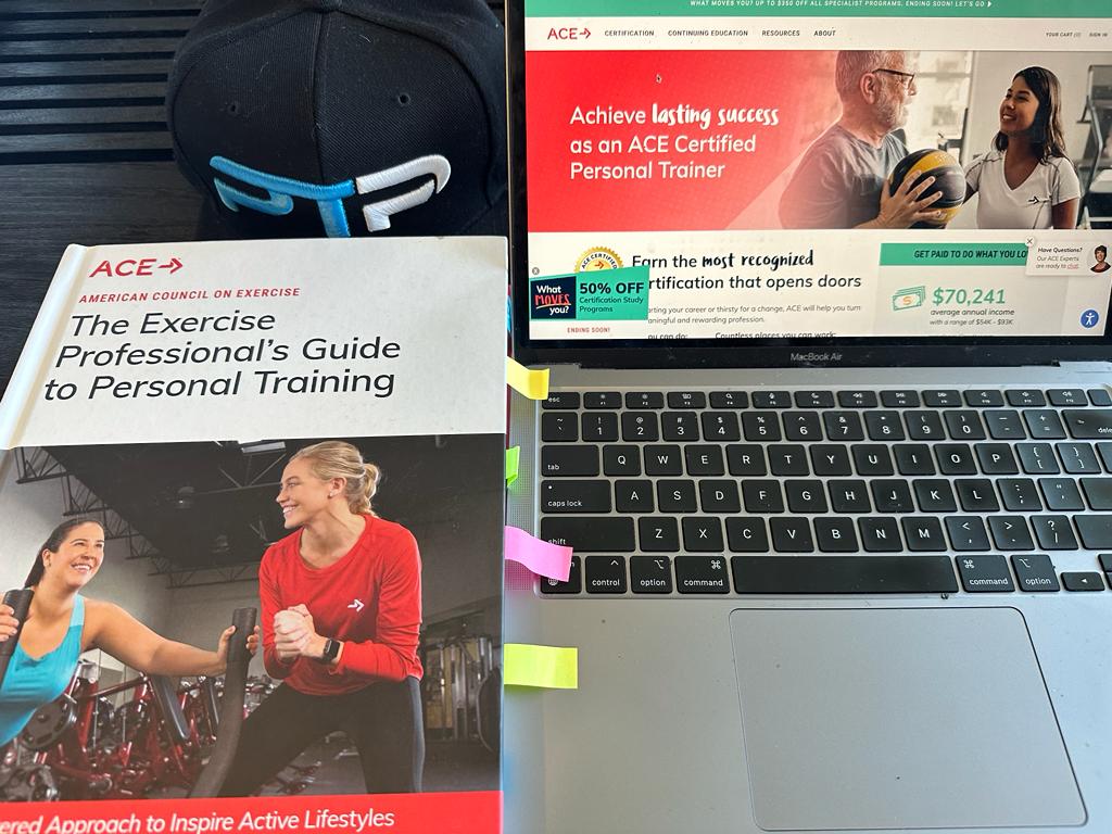 best online personal training certification - ace cpt textbook next to laptop with ace website and ptpioneer hat