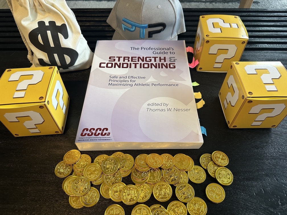 cscca certification - strength and conditioning textbook on table with gold coins, question mark boxes, and money bag - how much does the cscca cost