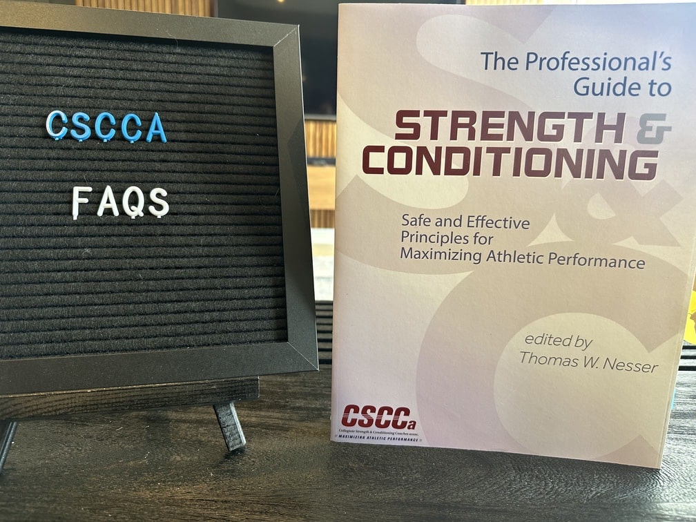 CSCCa certification - strength and conditioning book with black board with letters - cscca faqs