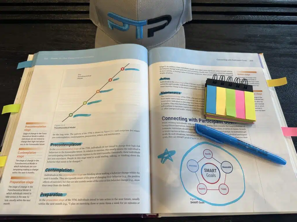 AFAA Group Fitness Instructor Certification Review 18 AFAA Group Fitness Instructor exam prep and study materials - AFAA group exercise textbook open to SMART goals page.