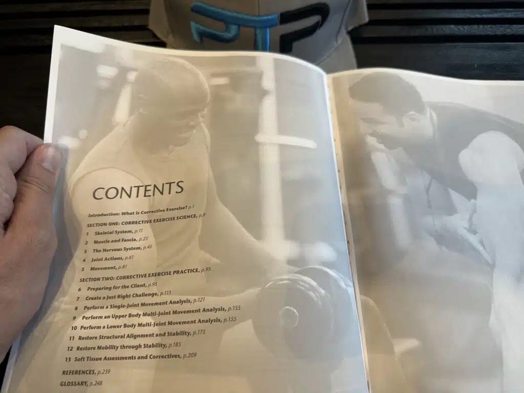 ISSA Corrective Exercise Specialist Review (2023) 17 ISSA CES course layout - ISSA corrective exercise textbook open