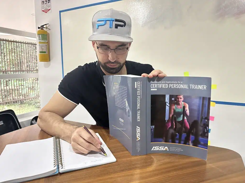 ISSA Training Certification Review 2023 - Is ISSA Worth It? 21 ISSA Trainer certification exam - Tyler Read taking notes for the ISSA CPT exam