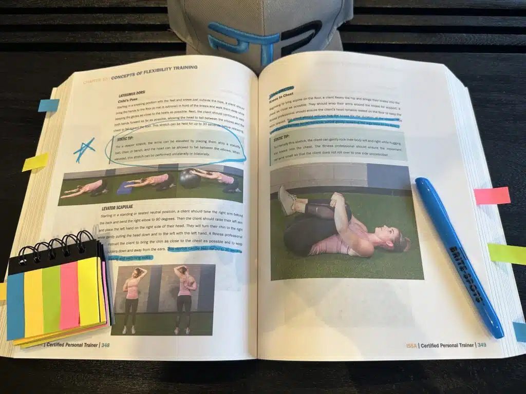 ISSA Training Certification Review 2023 - Is ISSA Worth It? 20 issa training certification study textbook - ISSA textbook open to stretching chapter with highlight