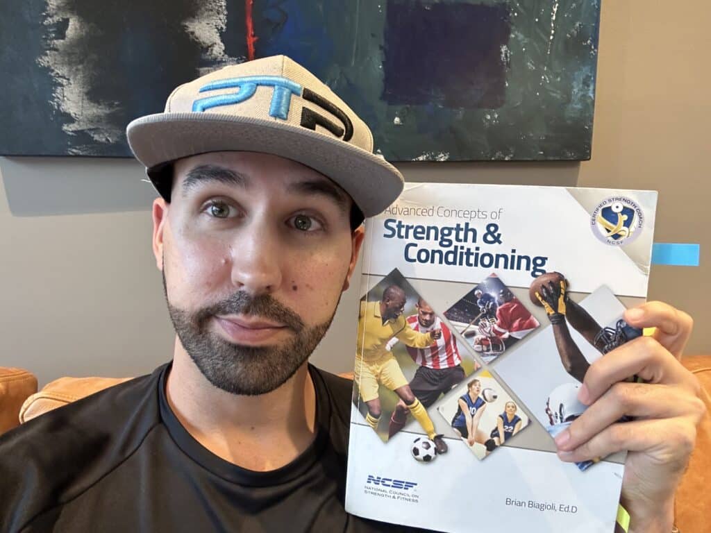 ncsf csc review - Tyler Read holding the NCSF Advanced Concepts of Strength and Conditioning textbook