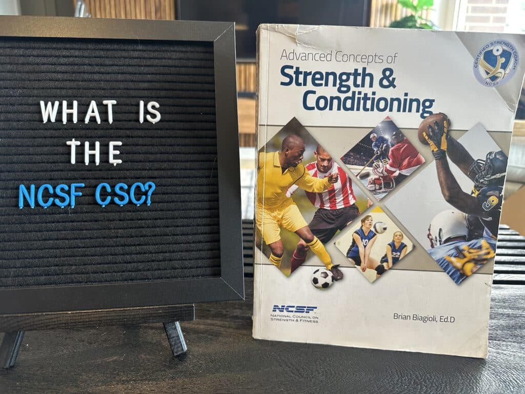 what is the ncsf csc - NCSF Strength coach textbook displayed on table next to board with lettering