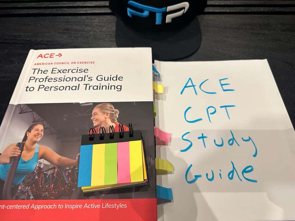 ACE Study Guide - ACE CPT textbook laid on table for preparing for the ACE exam.