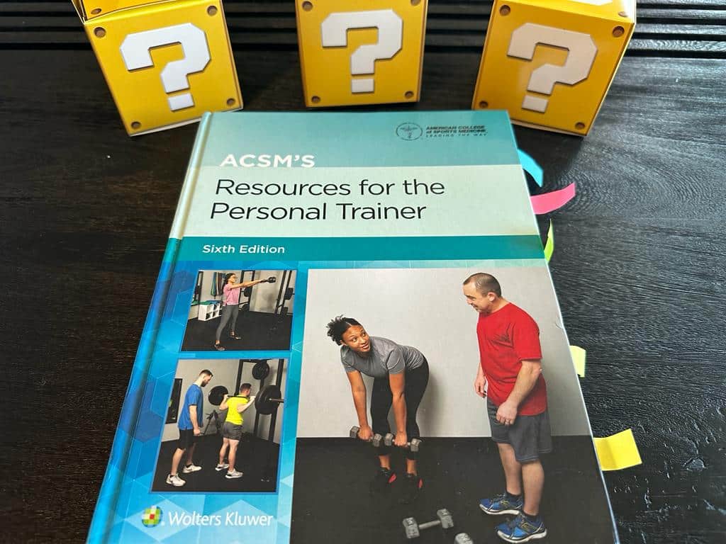 ACSM CPT - Best Personal Trainer Certification programs - ACSM textbook laid out with yellow question boxes 