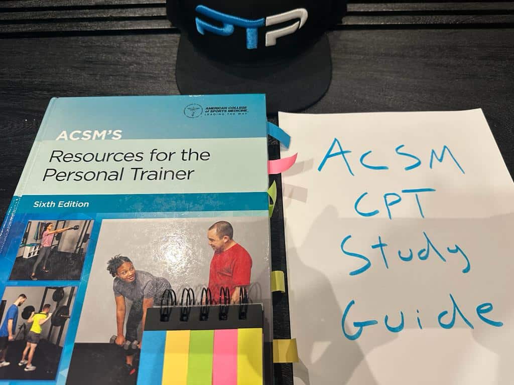 Free ACSM study guide - ACSM textbook placed on table in preparation for ACSM CPT studying.