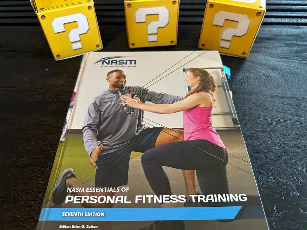 NASM CPT - Best Personal Trainer Certification programs - NASM textbook with yellow question mark boxes