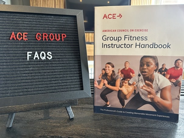 ace group exercise instructor review - ACE FAQs - ace textbook next to blackboard with frequently asked questions