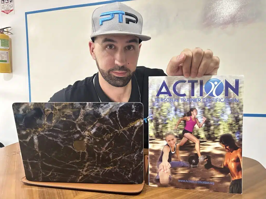 action cpt review - Tyler Read holds the ACTION personal trainer certification textbook