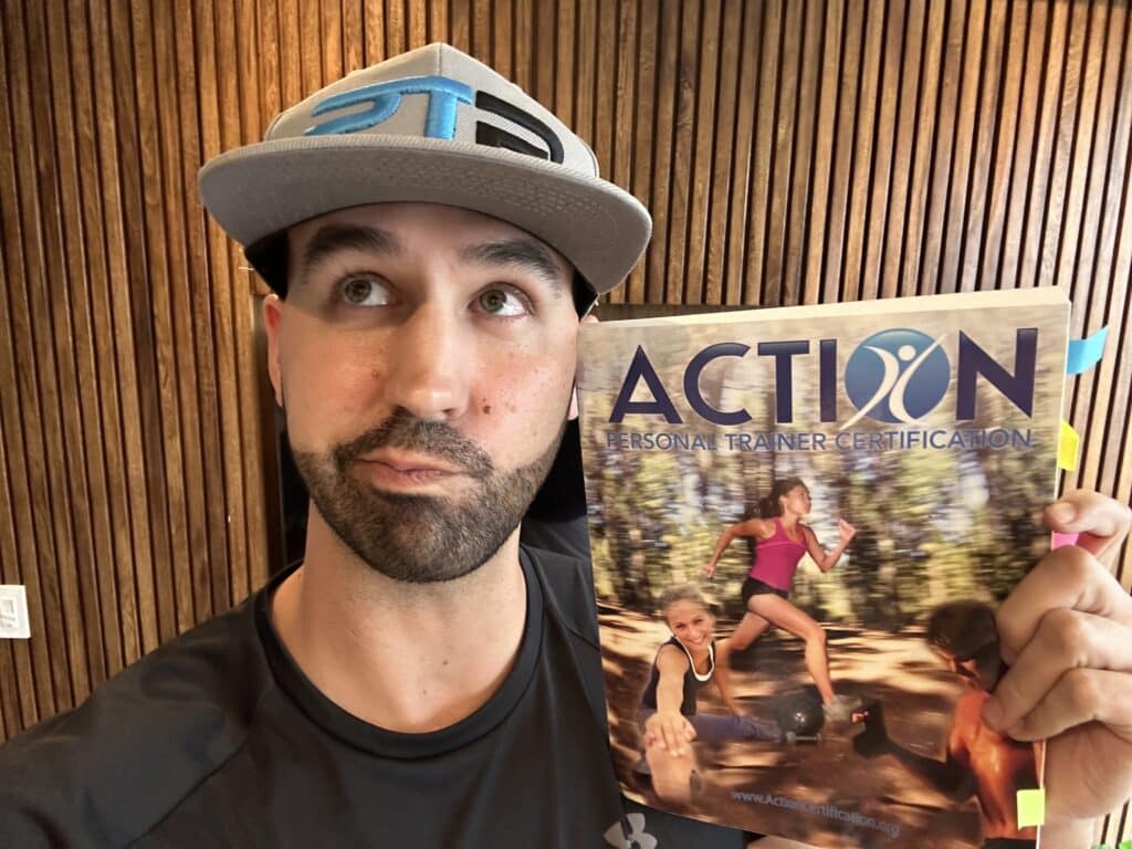 ACTION personal training certification review - Tyler Read holds up the ACTION textbook and decides whether the ACTION CPT is worth it for his training career.