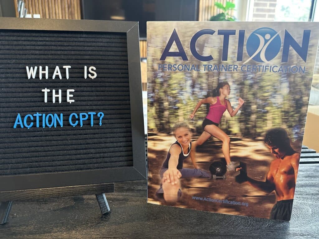 ACTION certification review - what is the ACTION CPT? ACTION personal trainer textbook displayed on table.