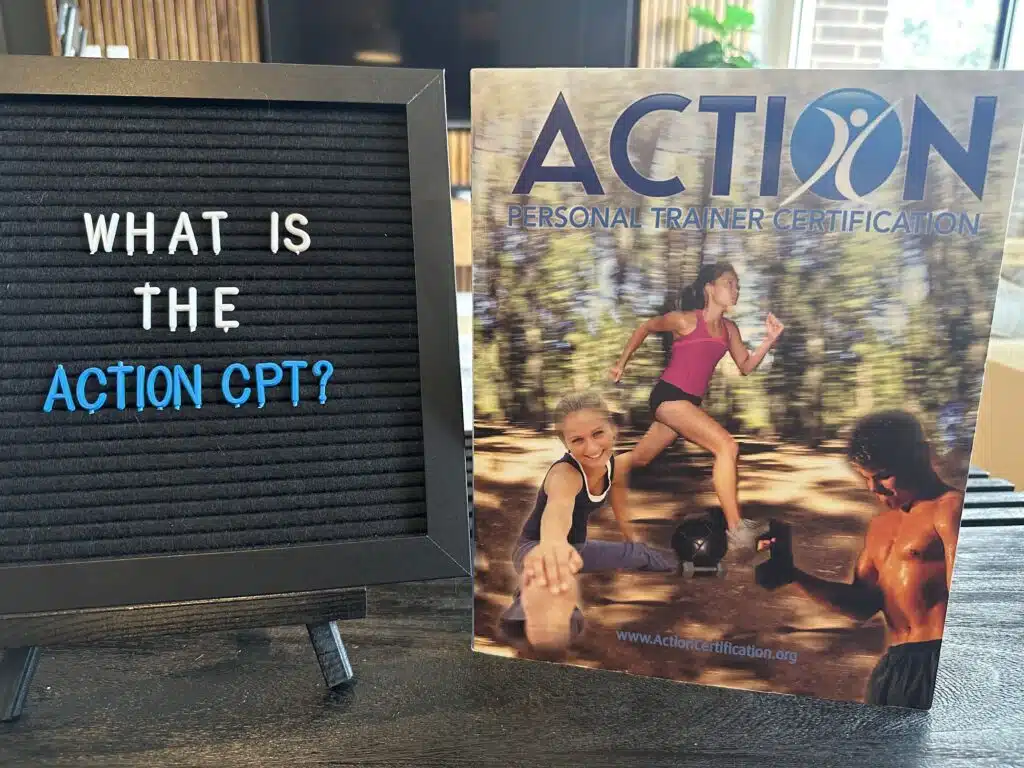 ACTION certification review - what is the ACTION CPT? ACTION personal trainer textbook displayed on table.