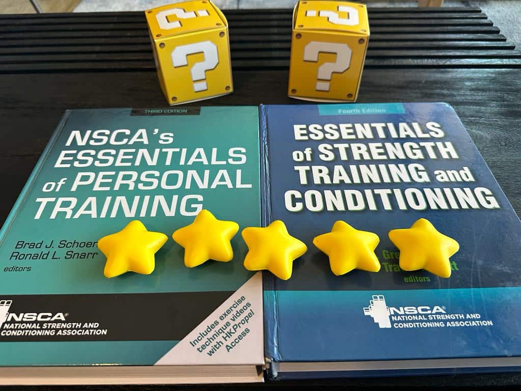 NSCA CPT vs CSCS - textbooks on table with yellow stars and question mark boxes - which is best, the CPT or CSCS?