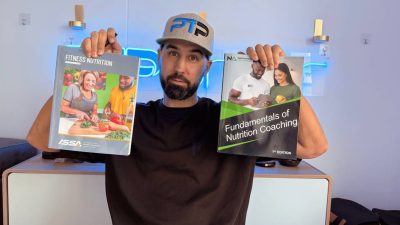 Tyler Read holds up IPTA and CNS and ISSA Nutritionist textbooks, which is better