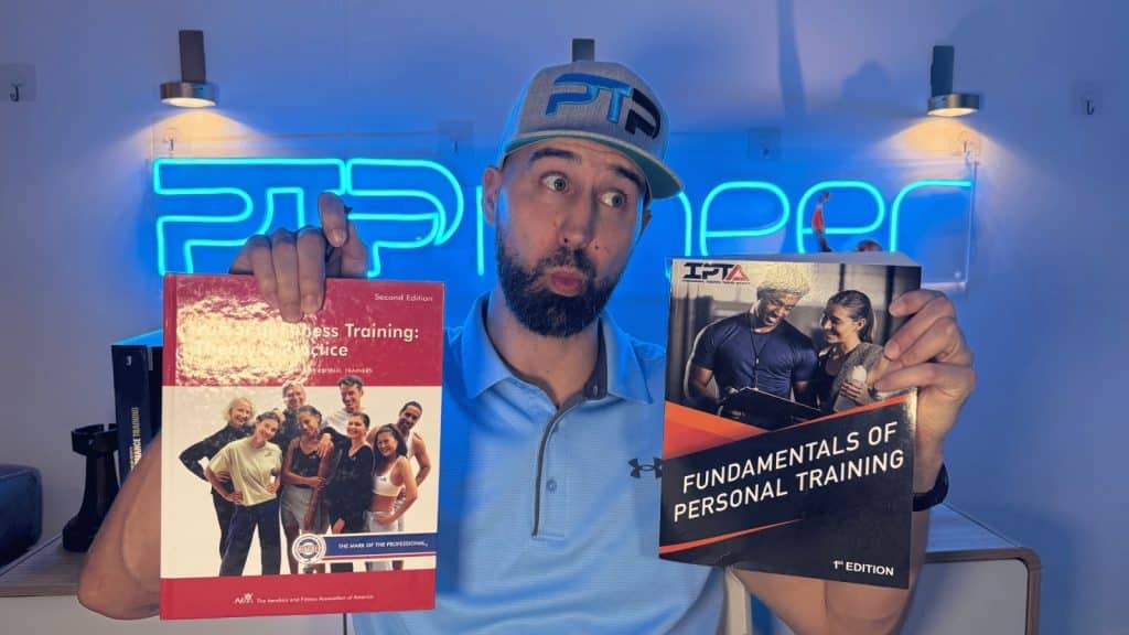 IPTA CPT vs AFAA CPT — Which CPT Should You Choose? 5 Tyler holding IPTA and AFAA textbooks