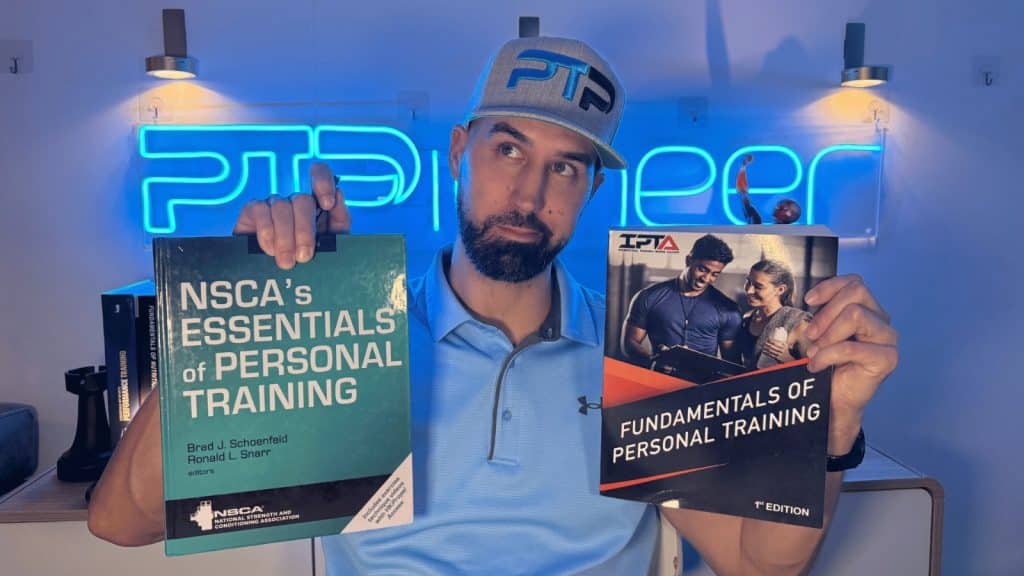 IPTA CPT vs NSCA CPT - Which One Should You Pick? 7 Tyler holding IPTA and NSCA textbooks